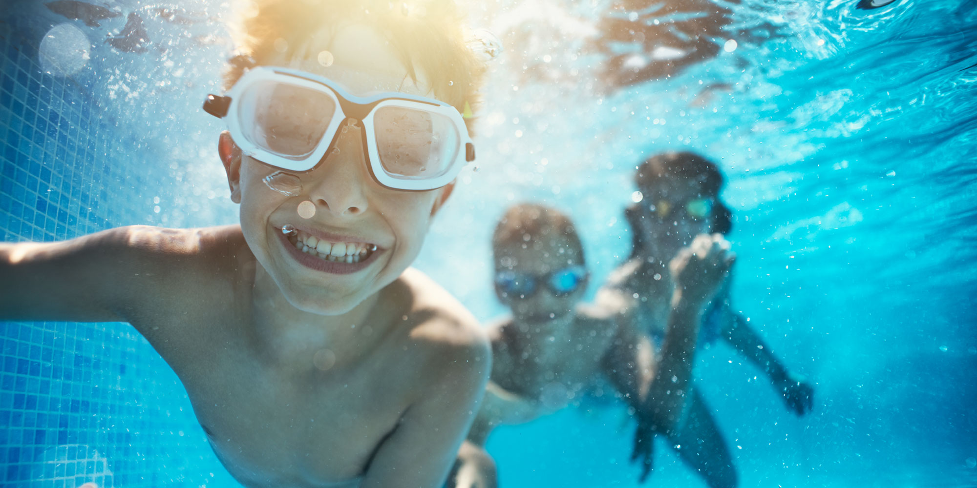 Underwater view of kids swimming